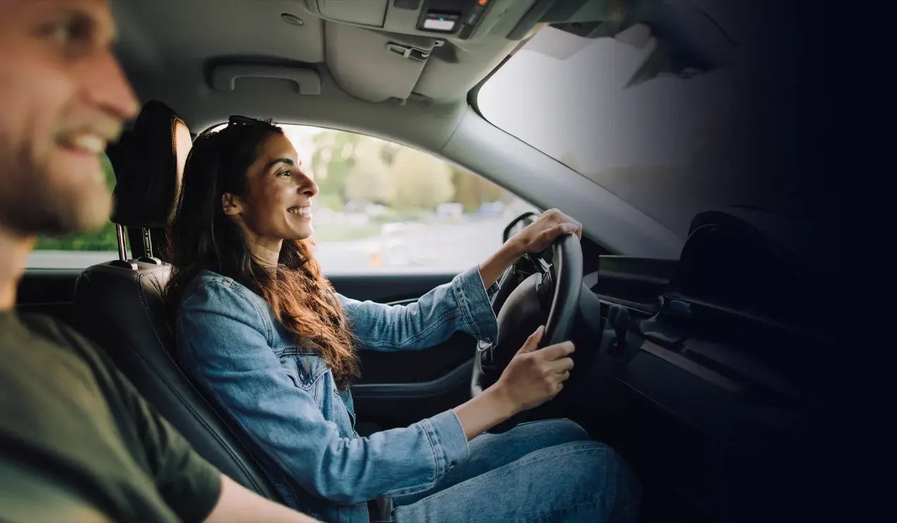 Interior shot of a couple driving
