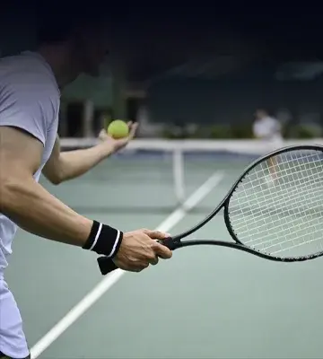 Tennis player about to serve